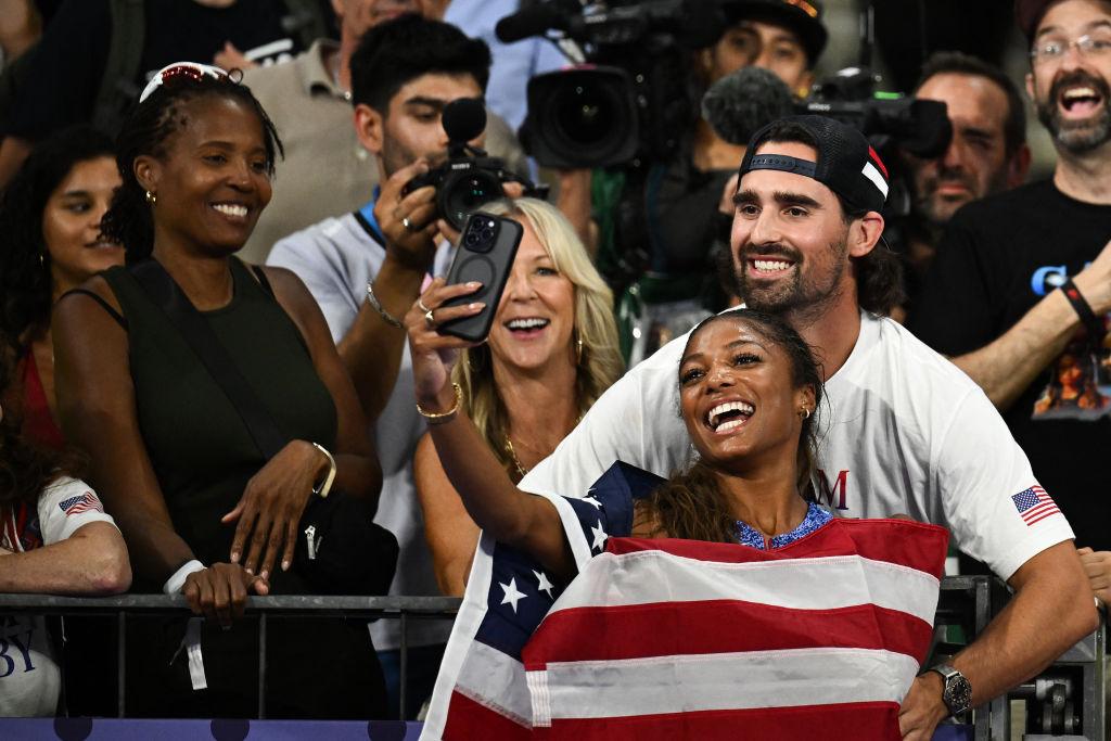 Gabby Thomas taking a selfie with her boyfriend Spencer McManes after winning gold.