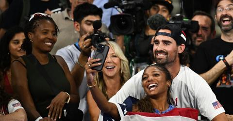 Gabby Thomas taking a selfie with her boyfriend Spencer McManes after winning gold.