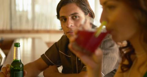 man and woman at bar