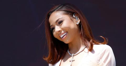 Mariah the Scientist smiles at fans on stage at Coachella.