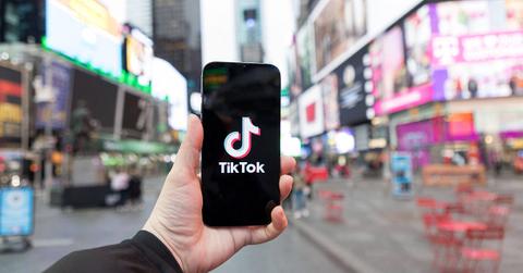 A TikTok logo on a phone screen in New York City.