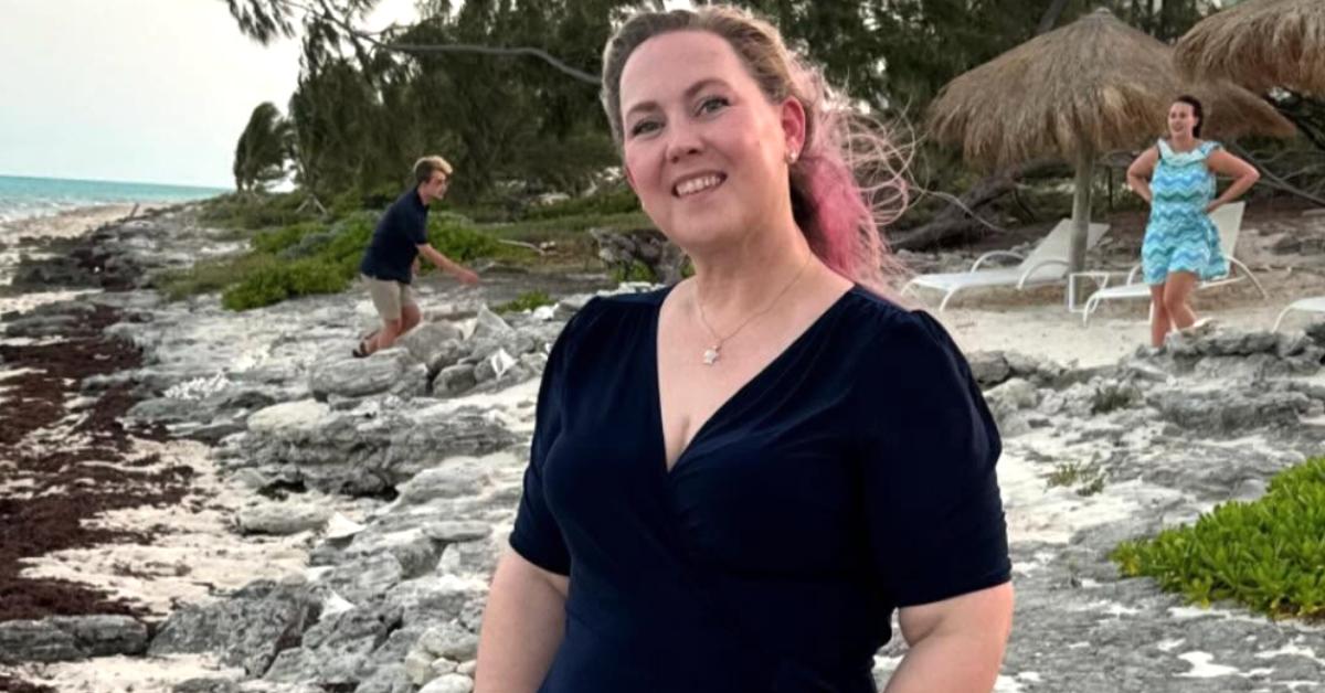 Rebecca Yarros standing on a beach