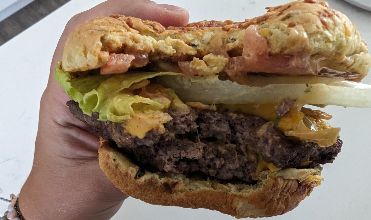 Wendy's Loaded Nacho Cheeseburger with a bite taken out