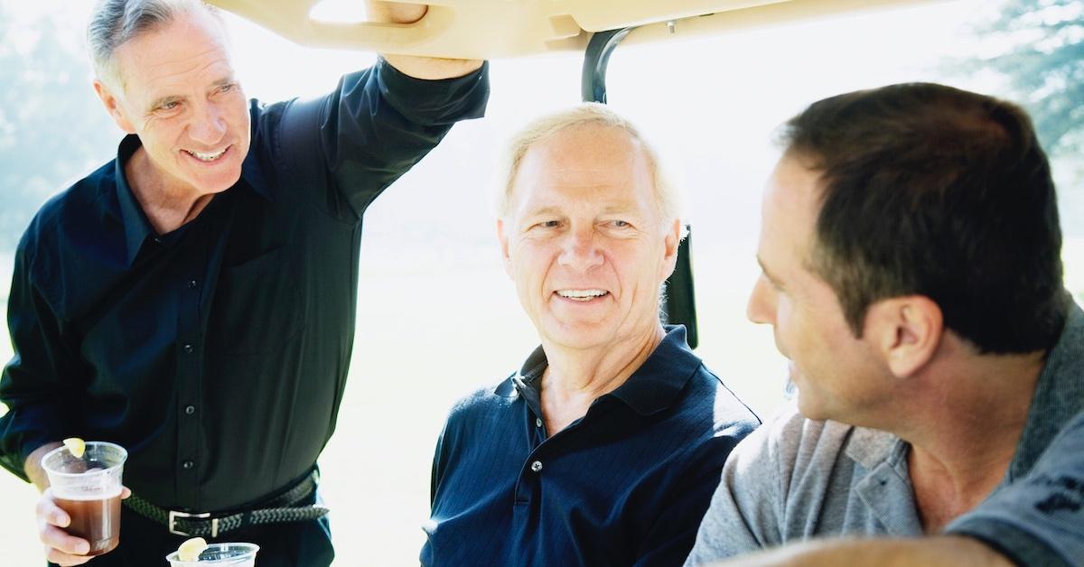 A group of men enjoying a drink on the golf course