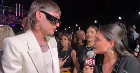 Peso Pluma giving an interview at the 2023 VMAs.