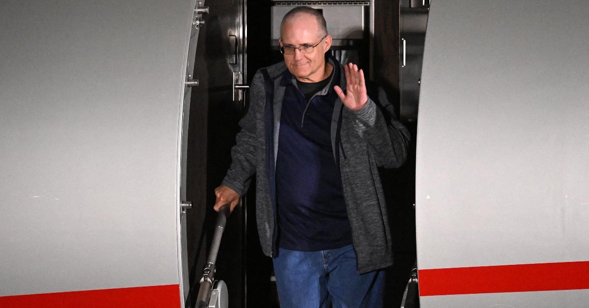 Paul Whelan exits a plane after being freed from a Russian prison