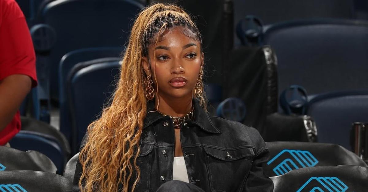 Angel Reese sitting courtside