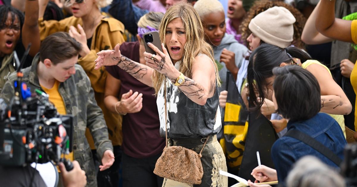 Jennifer Aniston gets oil thrown on her during climate change protest scene in NYC for Apple TV Plus's The Morning Show, in character as Alex Levy