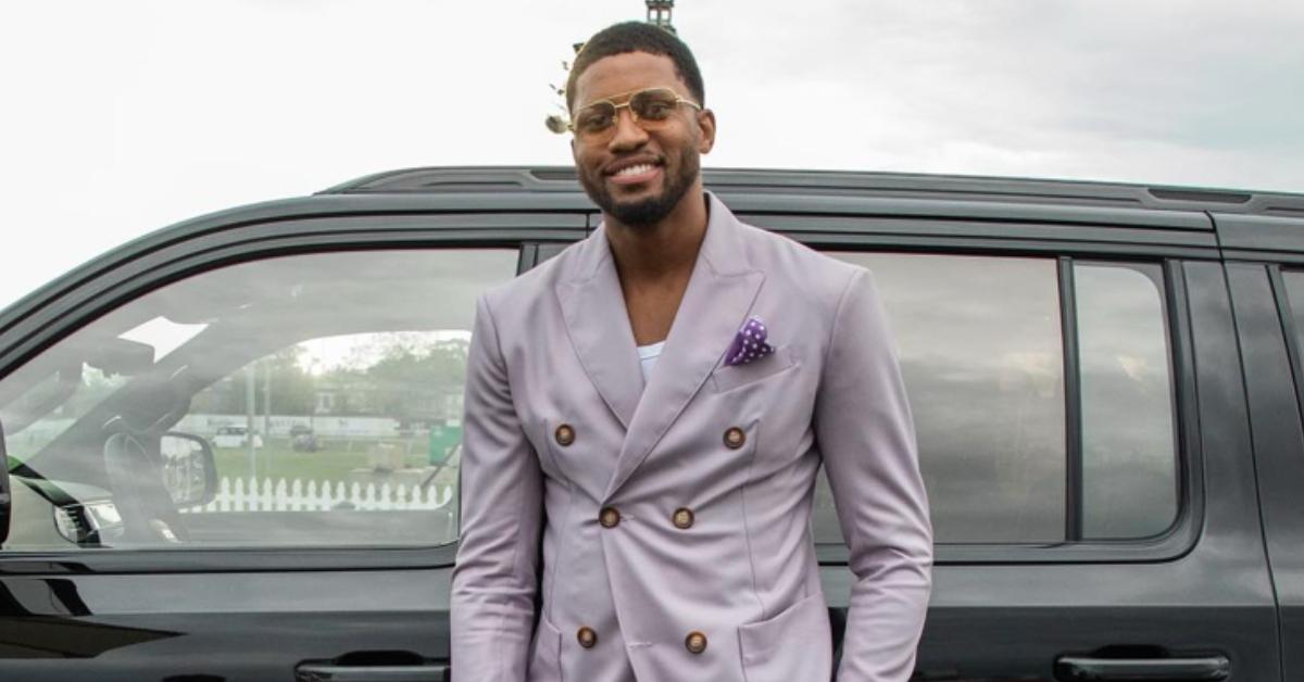 Rudy Gay wearing a light purple suit.