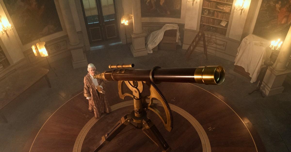The older King George III (James Fleet) looks through a telescope in his observatory 