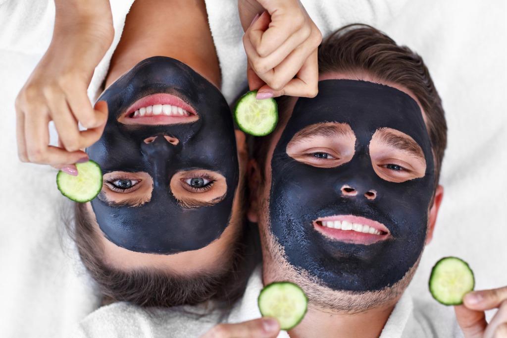 happy couple having facial in spa salon picture id