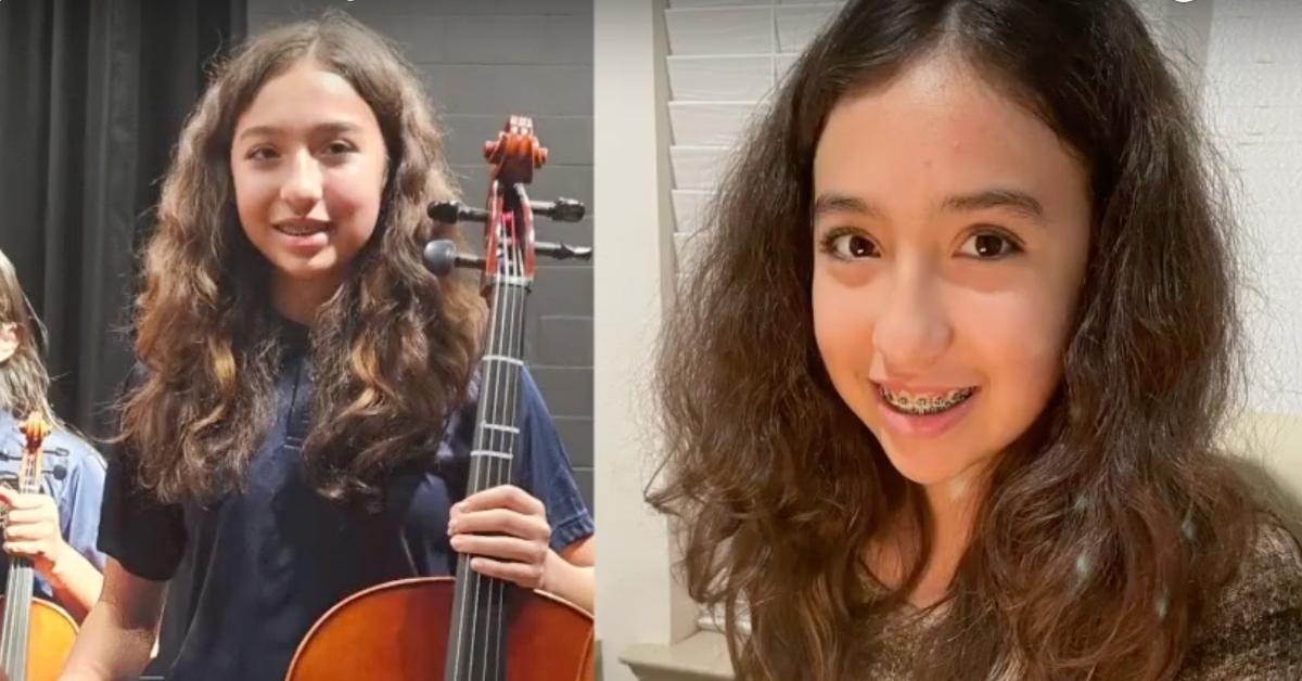 Jocelyn Nungary holds her cello and smiles