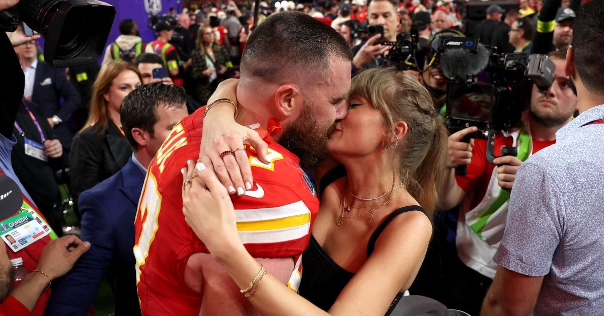 Travis Kelce and Taylor Swift embrace after Chiefs won Super Bowl LVIII.