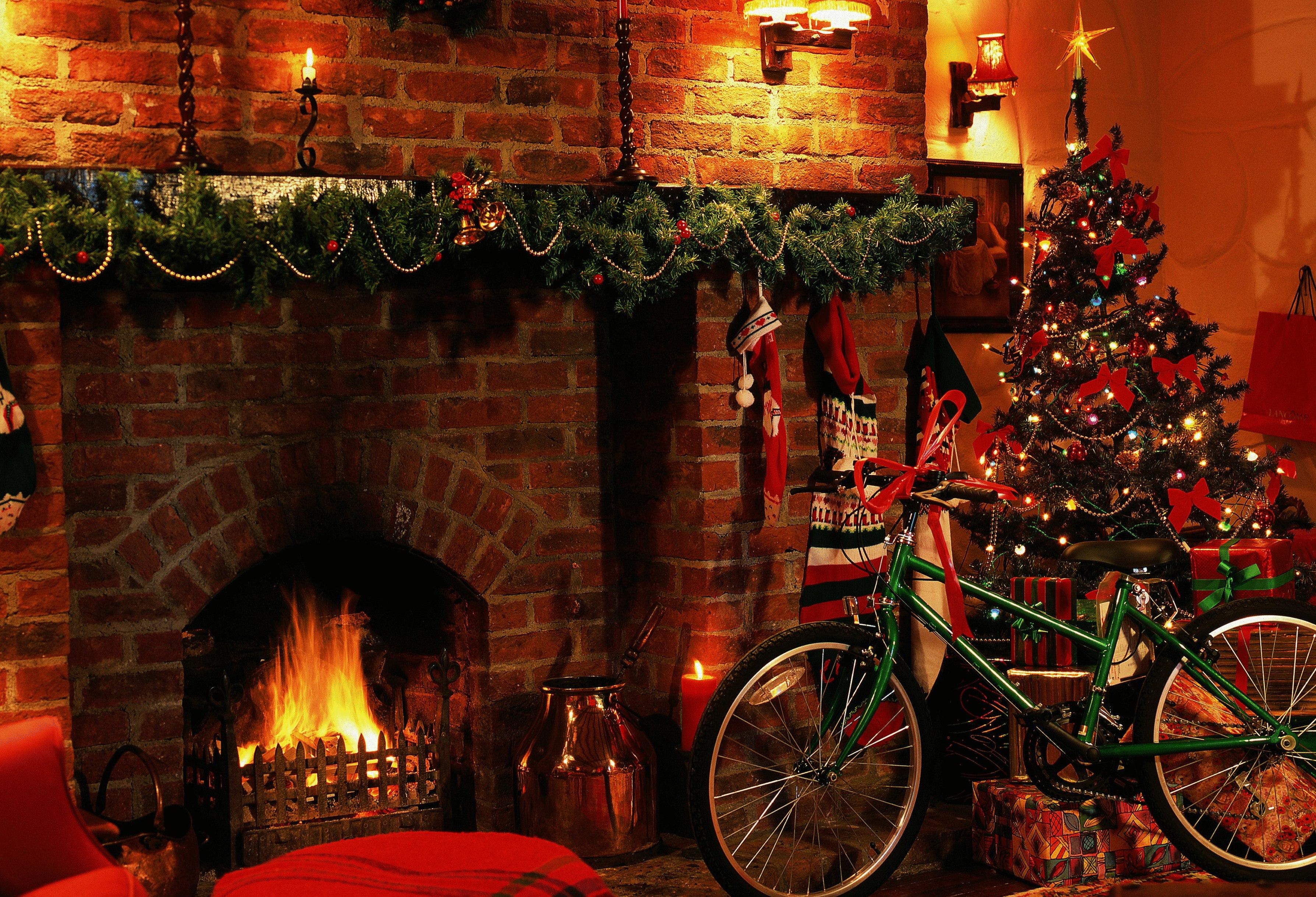 A living room decorated for Christmas, plus a brand new bicycle.