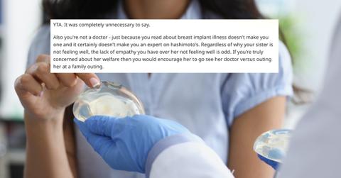 Female patient touching silicone implant on doctor hand with her finger closeup - stock photo