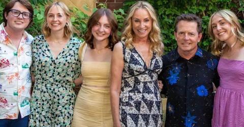 Michael J Fox posing with his wife and kids