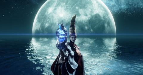 'Elden Ring' Queen Rennala standing in front of a moon with her staff.