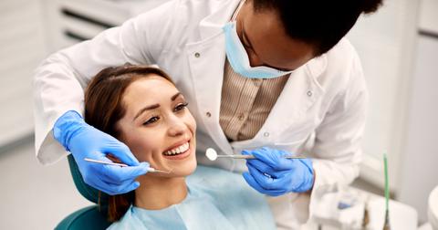 Young woman looks happy at the dentist.