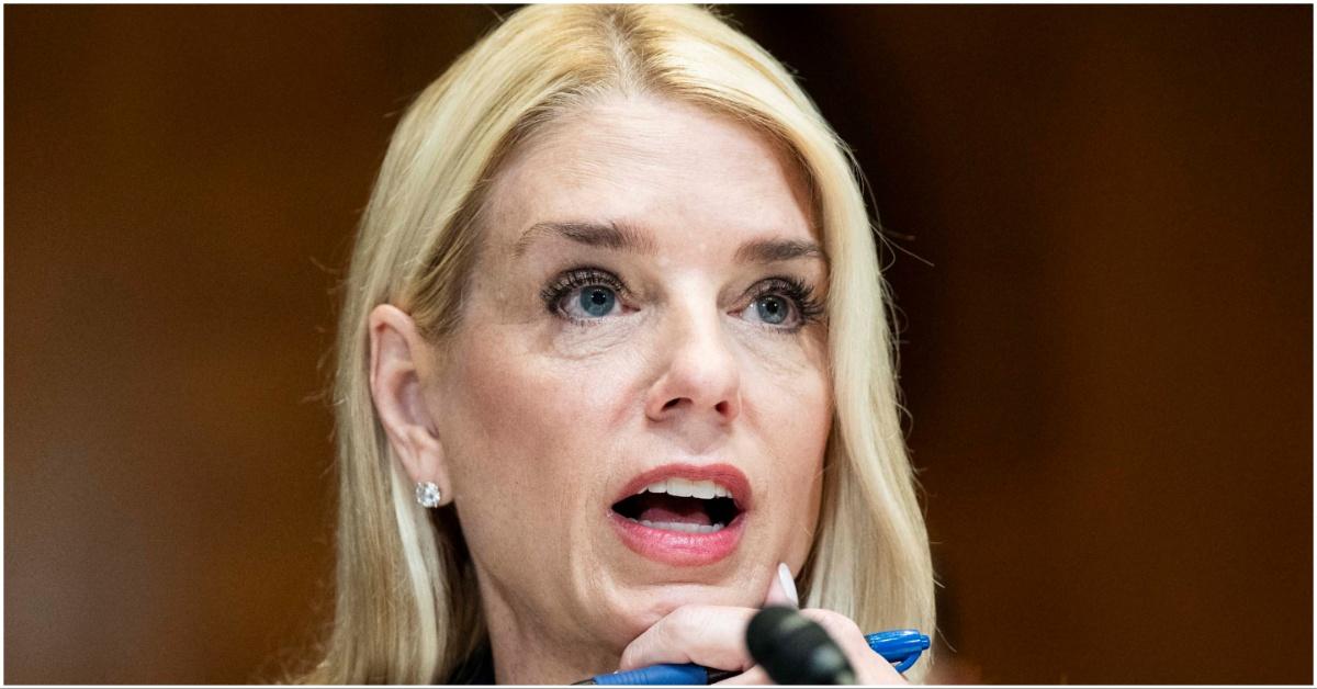 Pam Bondi talking into a microphone
