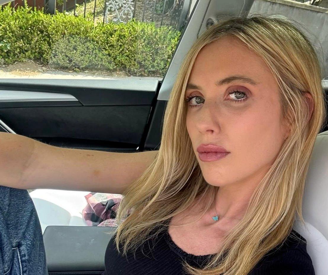 Laura Clery sitting in her car.
