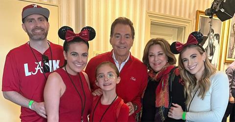 Nick Saban posing for a photo with his family.