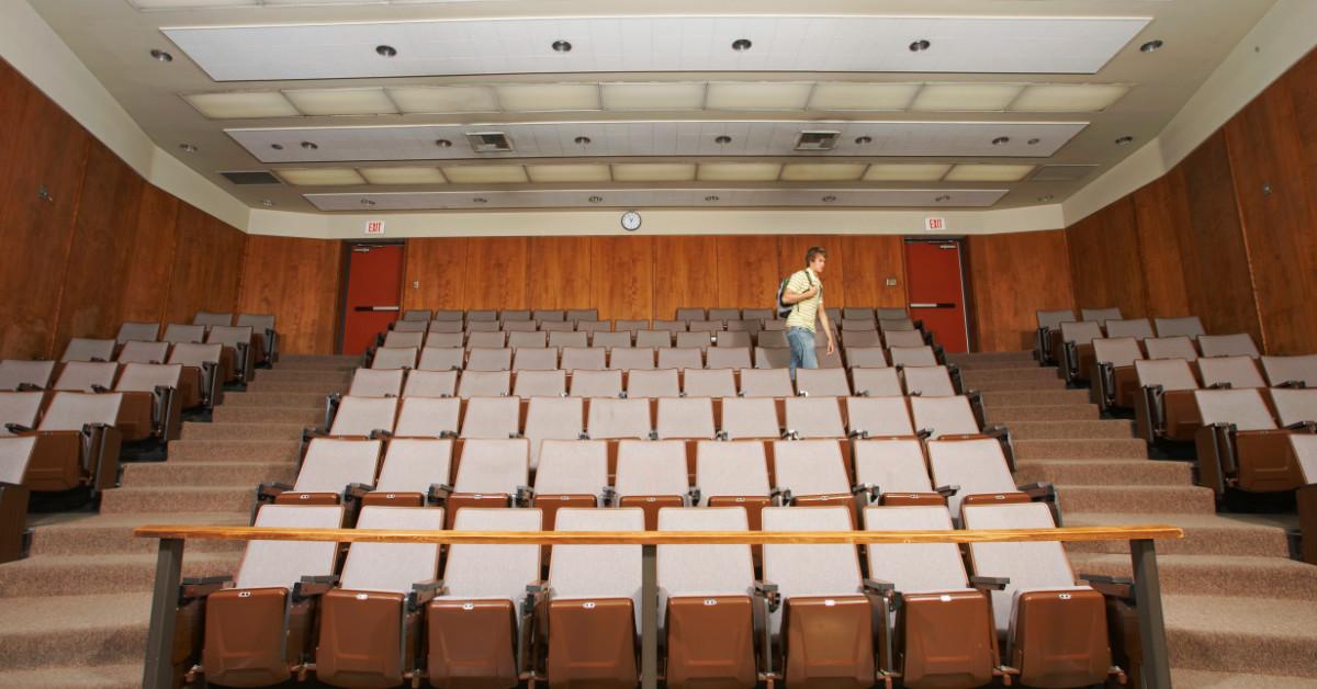 Student in college auditorium classroom