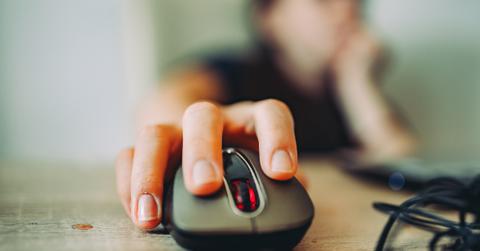 A person holding a computer mouse