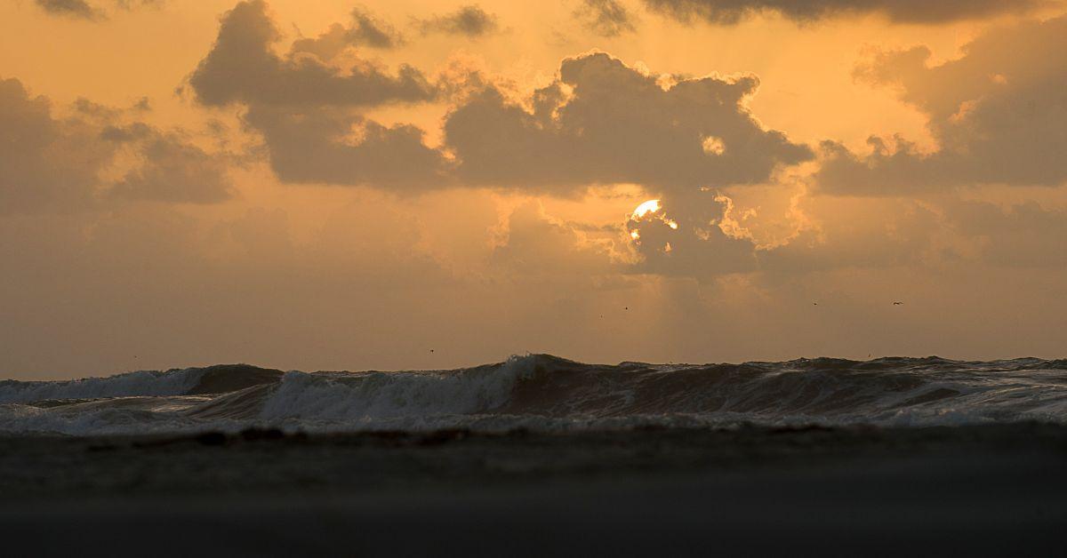 A wave breaks over the coast off the Gulf of Mexico. 