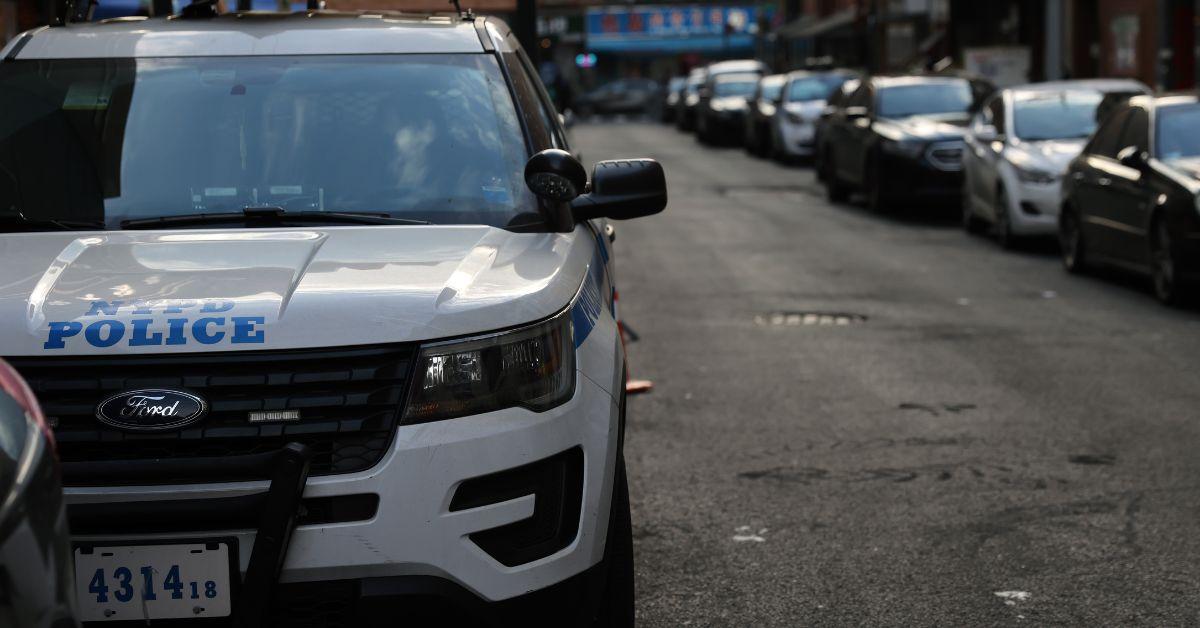 A police car parked on a street in New York.