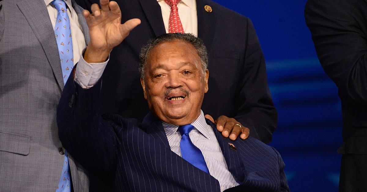 Reverend Jesse Jackson (C) attends during the first day of the Democratic National Convention