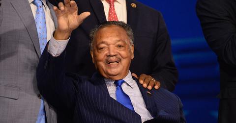 Reverend Jesse Jackson (C) attends during the first day of the Democratic National Convention