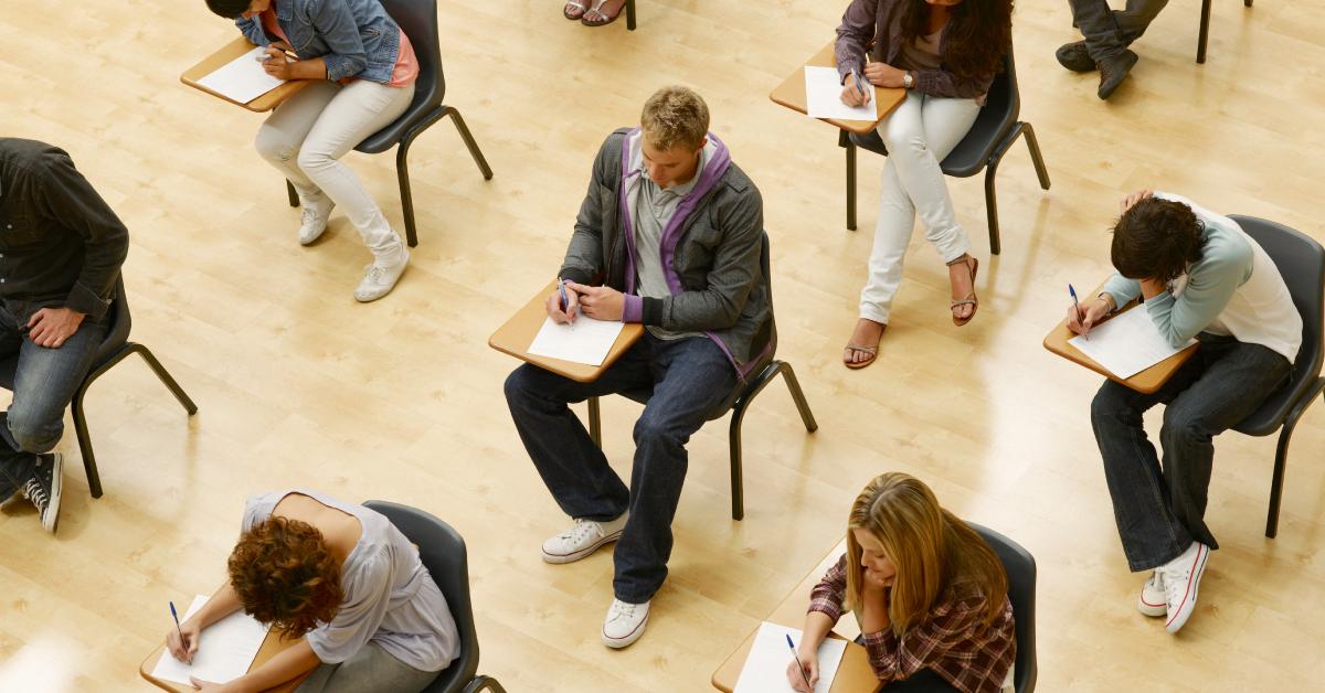 College students taking a test in the classroom.