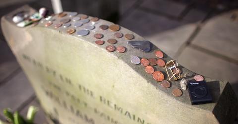 What Do Coins on a Grave Mean?
