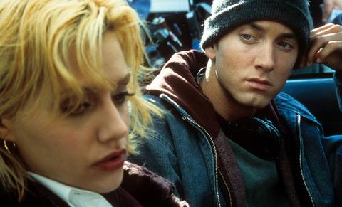 Eminem looking over at Brittany Murphy in a scene from the film '8 Mile' in 2002.