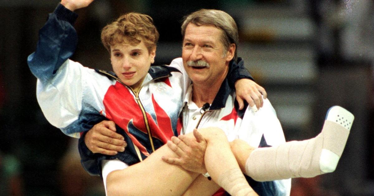 Bela Karolyi carries Kerri Strug