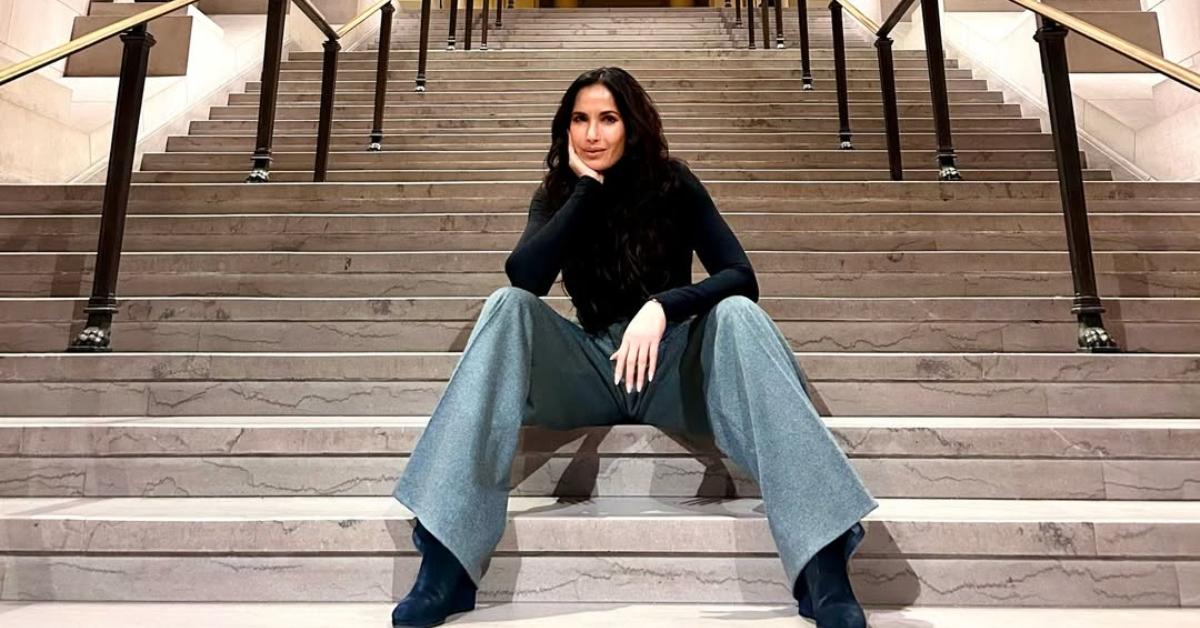 Padma Lakshmi sits on the steps at the Museum of Fine Arts in Boston.