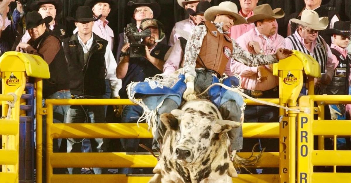 Spud Jones on a bull during a rodeo
