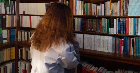 girl browsing bookshelf