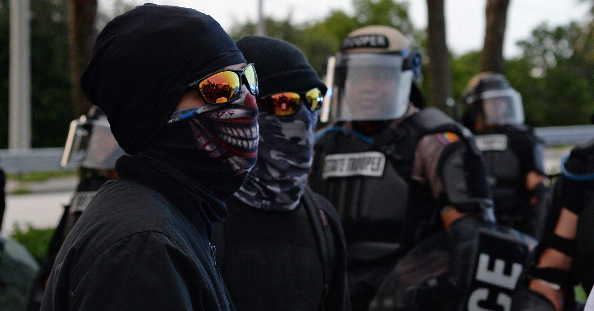 Antifa activists in all black gathered together.