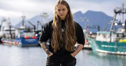 Bob Nielson poses for photo on the harbor with her hands in her pockets