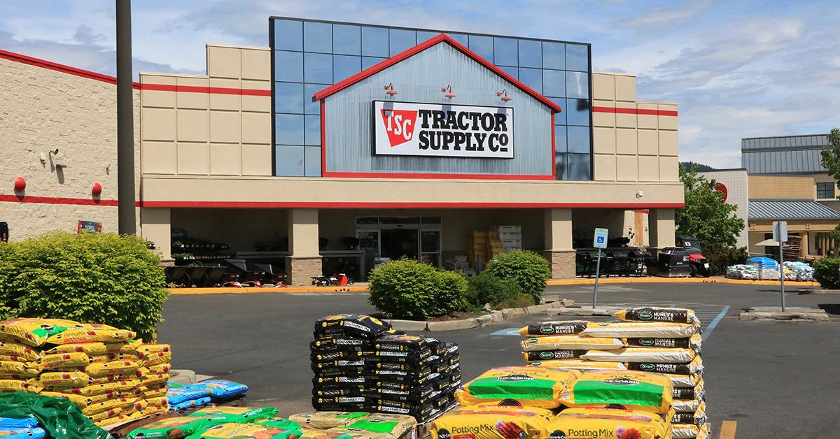 A Tractor Supply Company storefront with mulch in the front. 