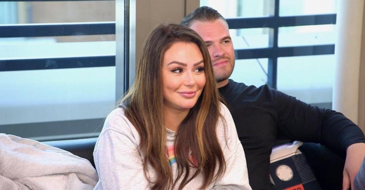 Jenni and Zack sit on a couch on vacation on 'Jersey Shore: Family Vacation'