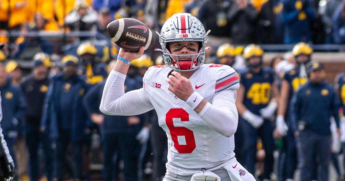 Kyle McCord throwing a football during a Michigan game. 