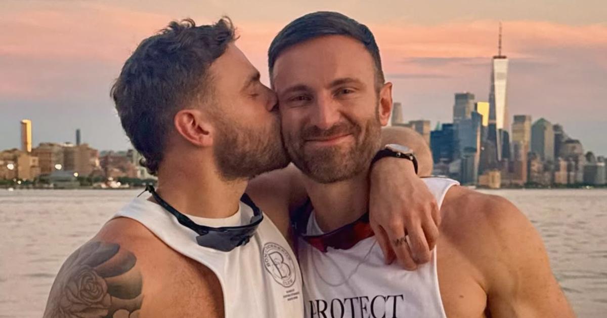 Gus Kenworthy kisses his boyfriend near the New York City skyline.