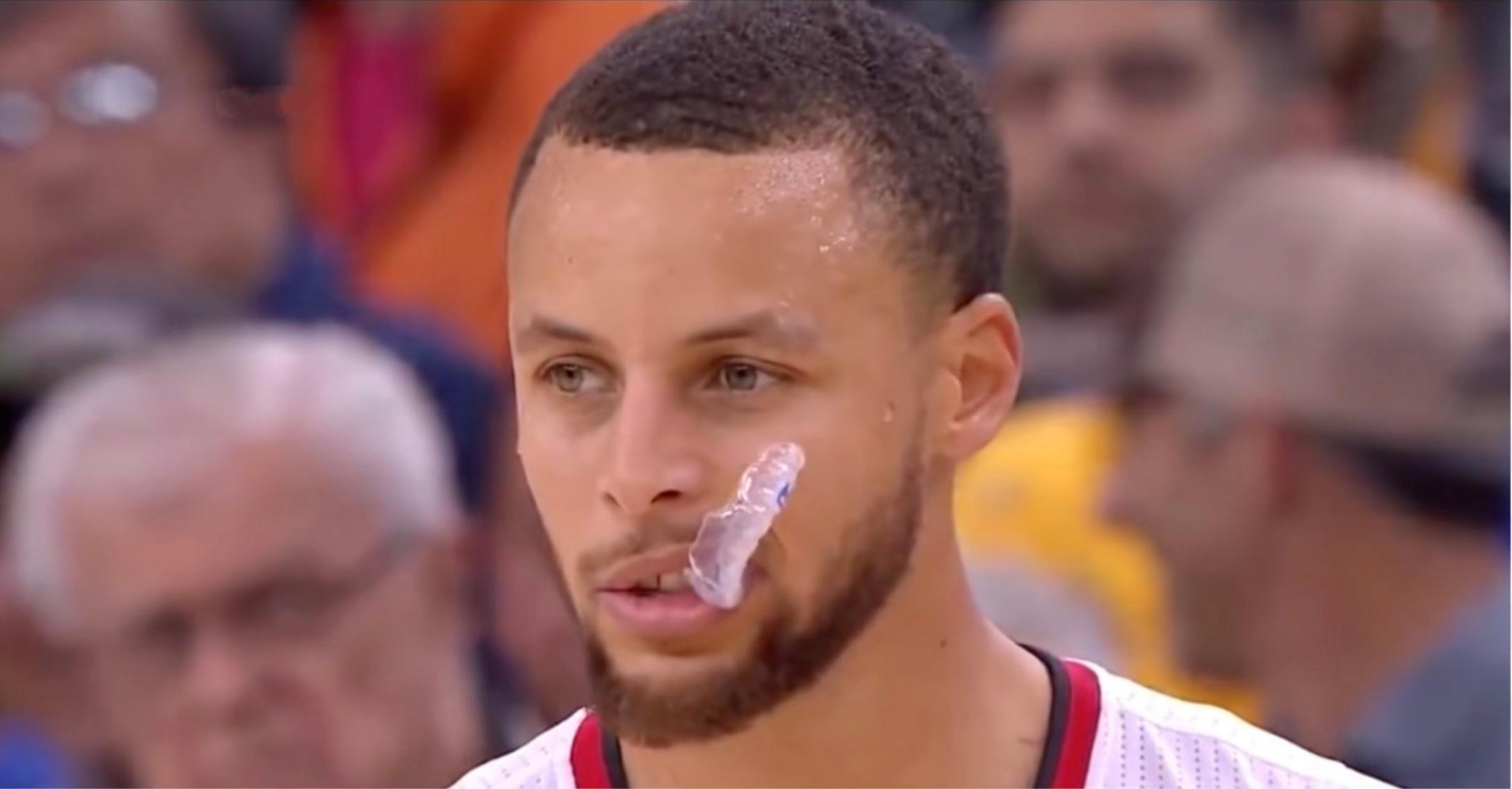Steph Curry chews his mouthguard during a game.
