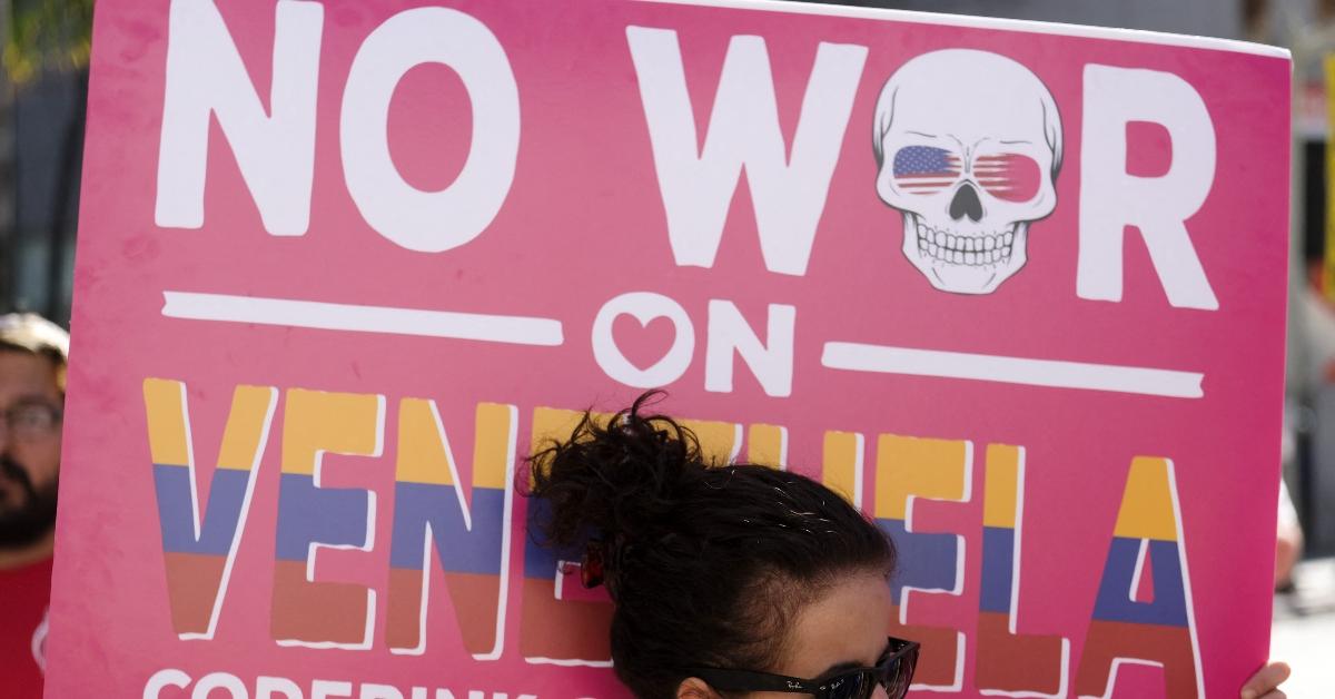 A woman protests about going to war with Venezuela