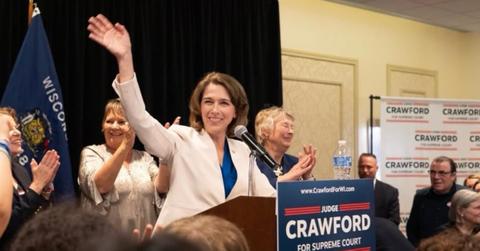 Susan Crawford waving to crowd.