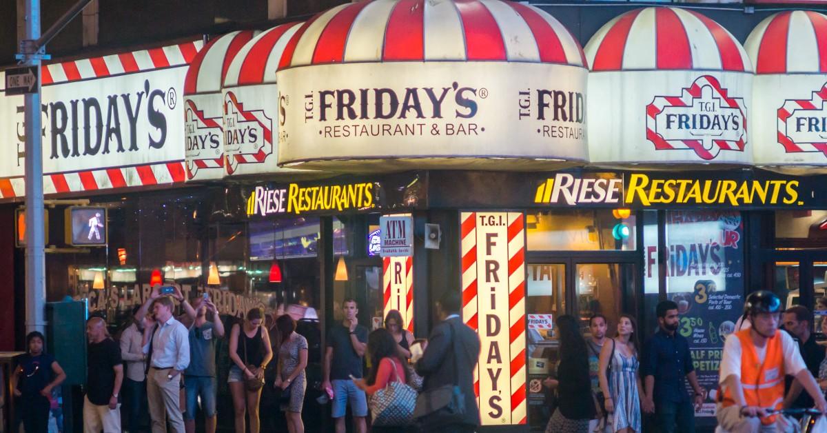 People standing outside of a TGI Fridays