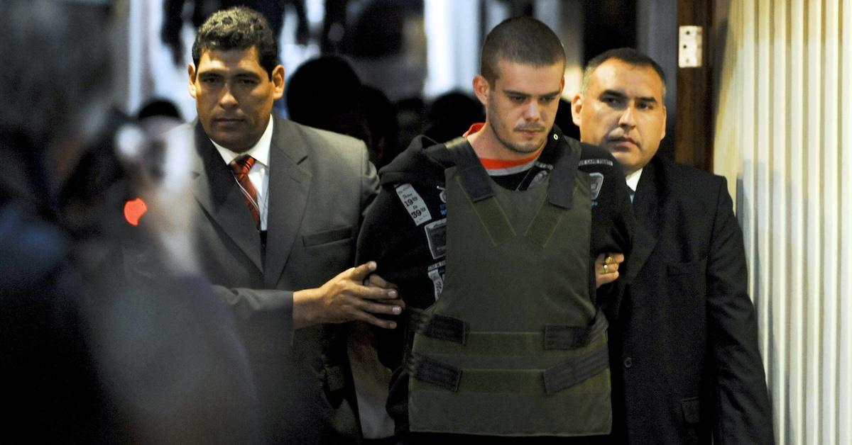 Joran Van der Sloot being led by security