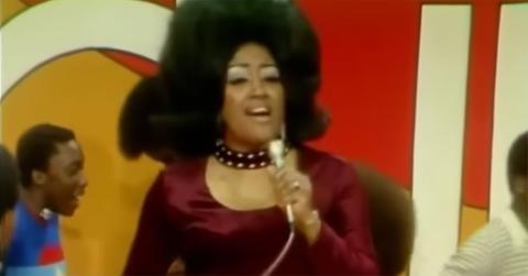 Jean Knight singing on 'Soul Train' in maroon.